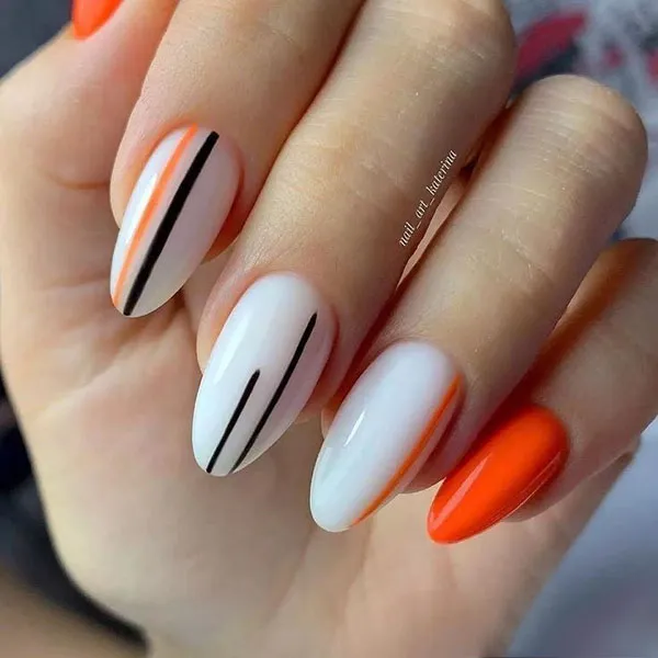 Orange and white nail design 17