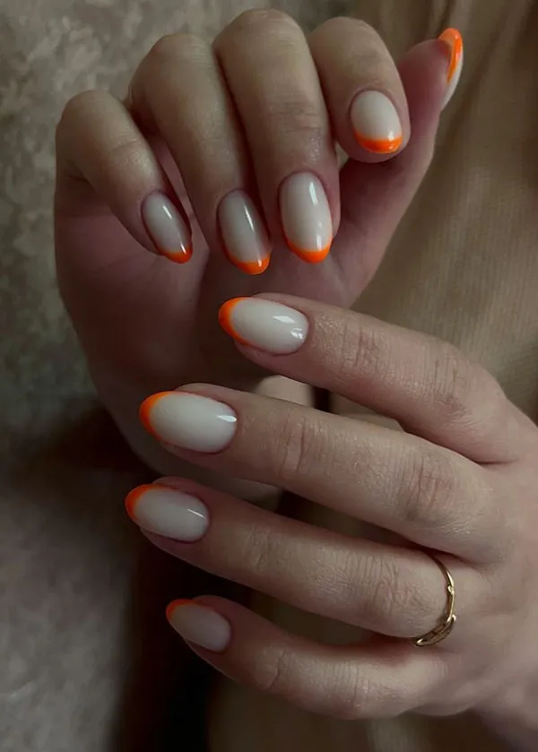 Orange and white nail design 18