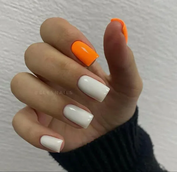Orange and white nail design 22