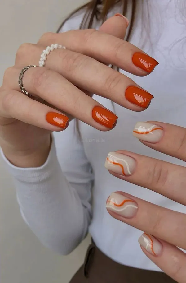 Orange and white nail design 26
