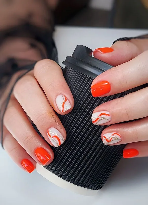 Orange and white nail design 9
