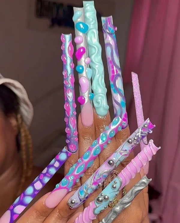 34 عکس از بلندترین ناخن ها؛ یا عاشقشی یا اصلاً نه!😎 9 The longest nail 7