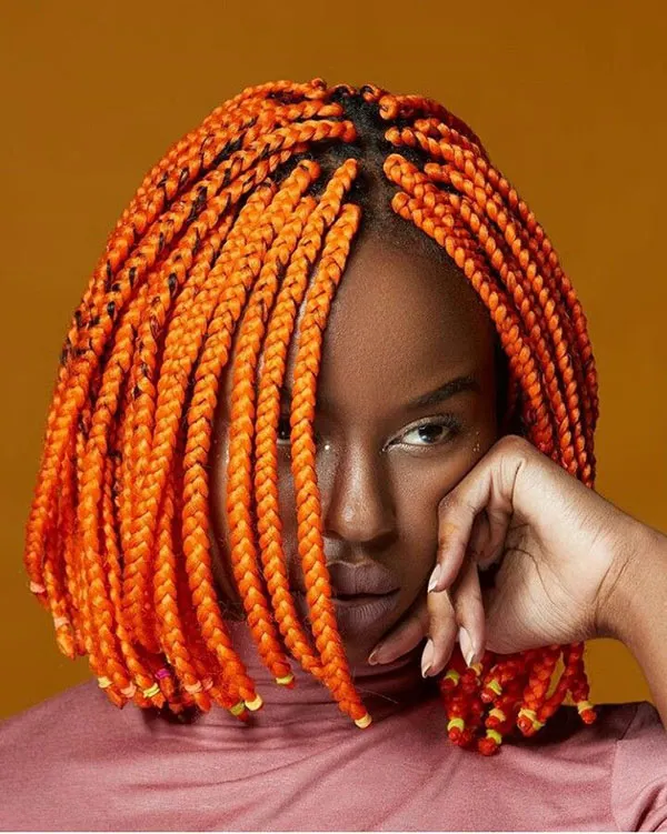 Braiding short hair with added colored hair extensions 10