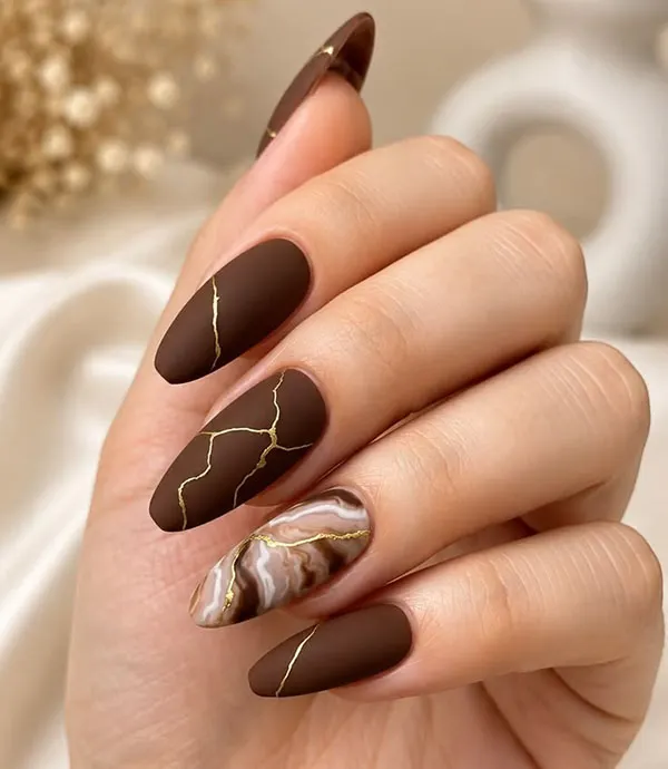 Chocolate themed nail design 26